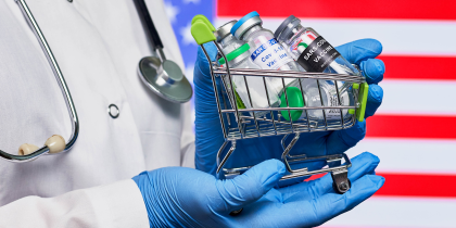 Various vaccines in front of an American Flag (CC BY 2.0 Marco Verch)