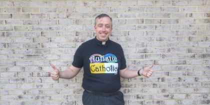 Myself in my Autistic Catholic shirt over clerics