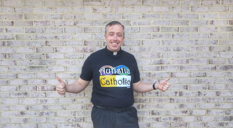 Me in my Autistic Catholic shirt