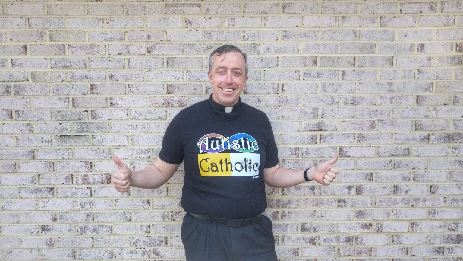 Me in my Autistic Catholic shirt