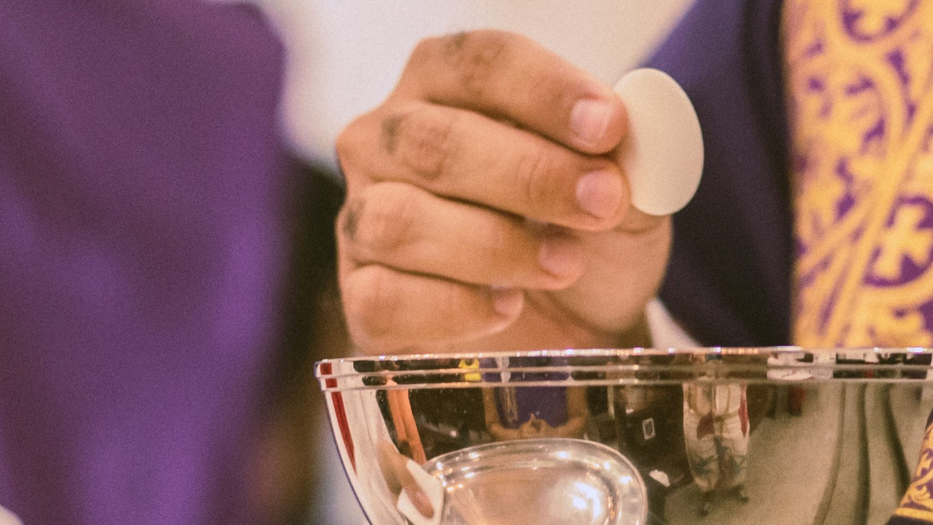 A priest distributing Communion