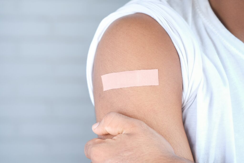 Bandage on arm after vaccine