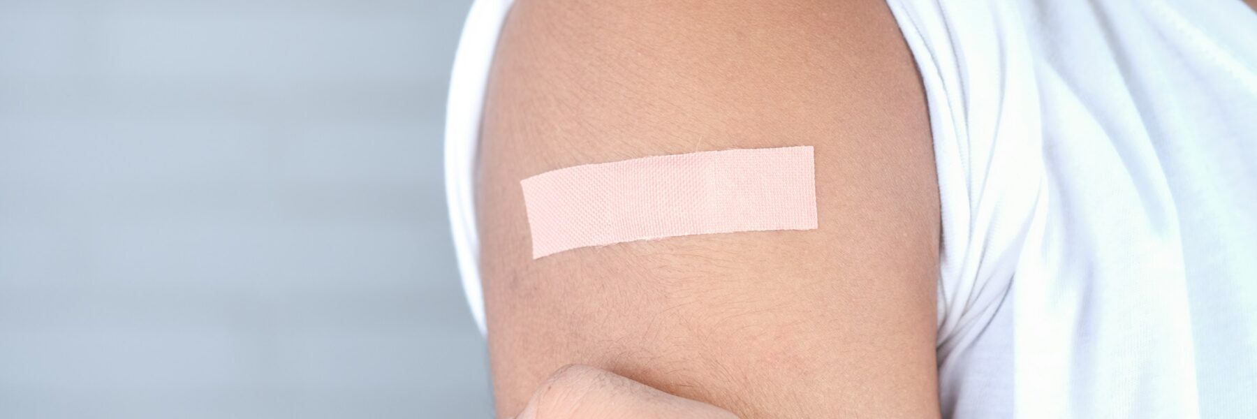 Bandage on arm after vaccine