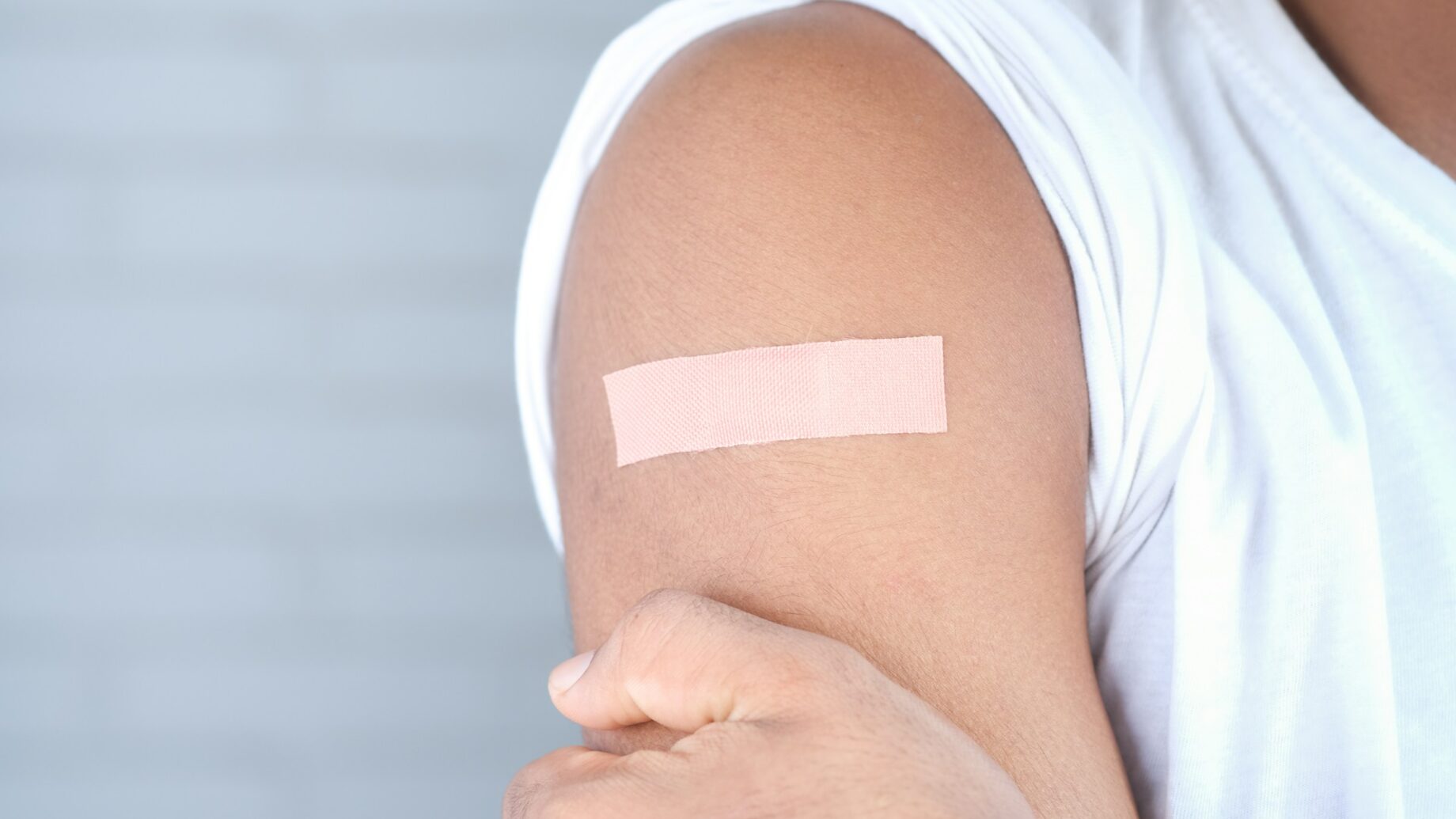 Bandage on arm after vaccine