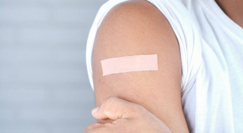 Bandage on arm after vaccine